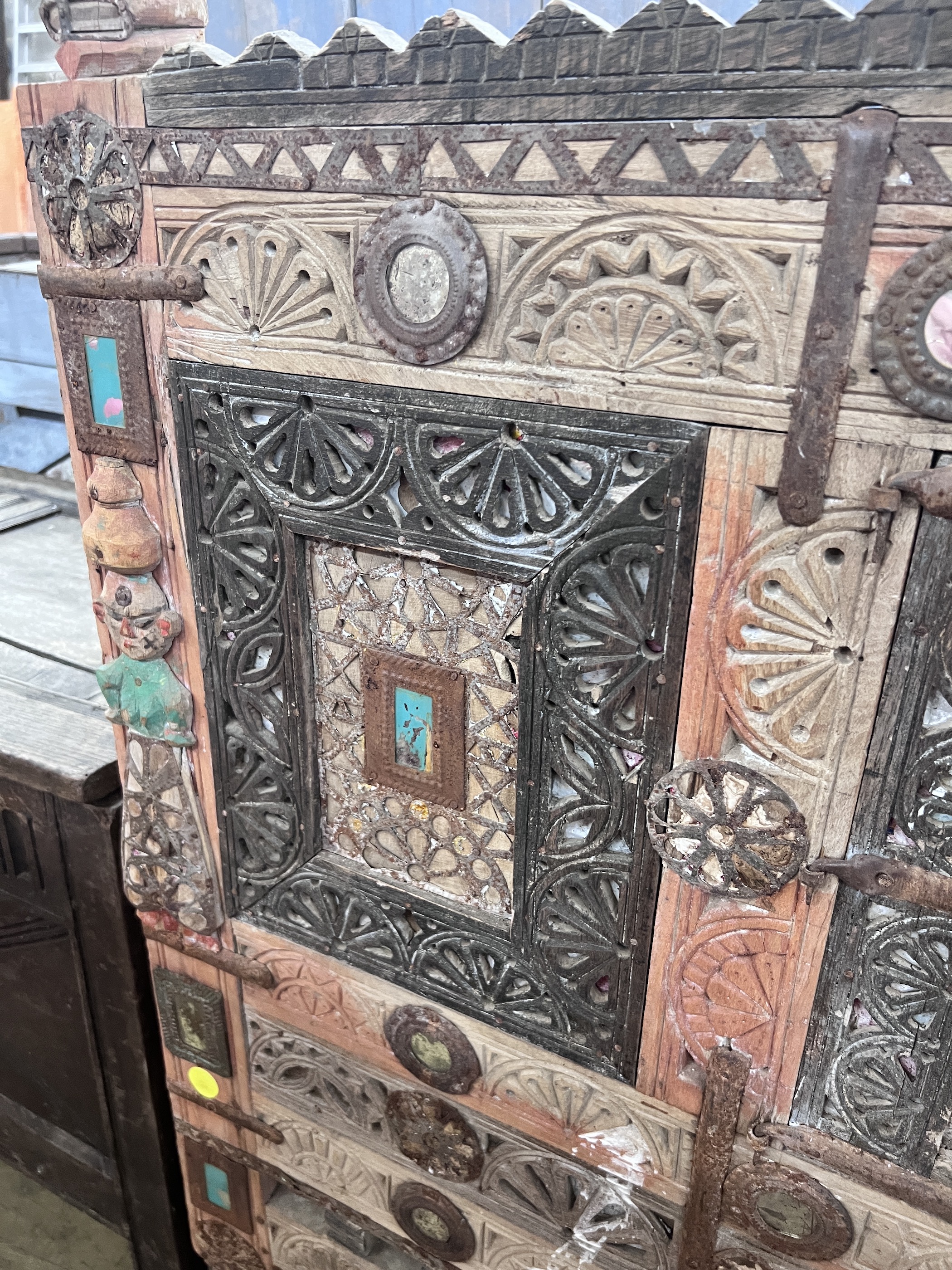 An Indian painted carved hardwood cabinet, width 124cm, depth 43cm, height 125cm